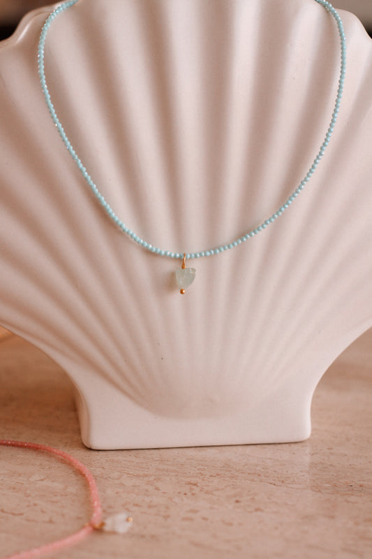 Kristal ketting blauw rond schelp